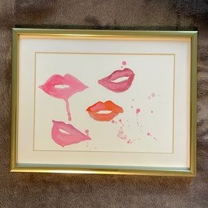 Lip print in a gold frame